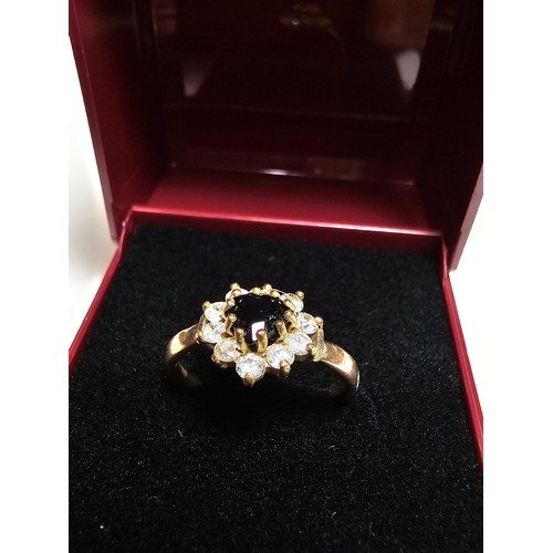 352 - A 9ct yellow gold cluster ring inset with a heart shaped black onyx stone to the centre surrounded b... 