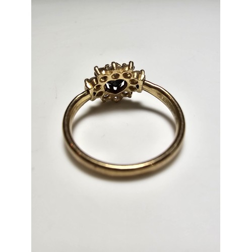 352 - A 9ct yellow gold cluster ring inset with a heart shaped black onyx stone to the centre surrounded b... 