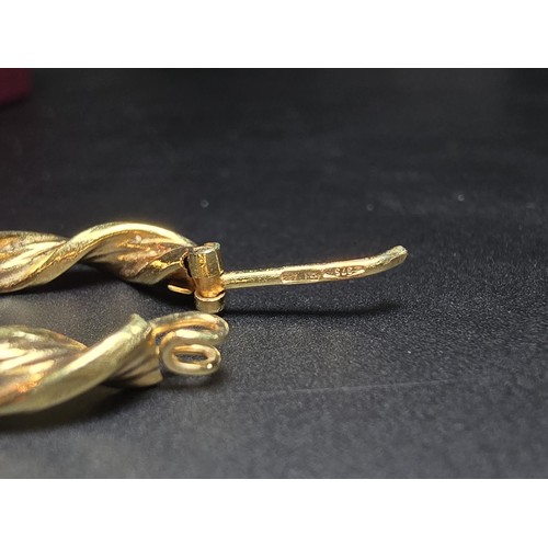 356 - A pair of hallmarked 9ct yellow gold earrings with a rope twist design along with 1 extra 9ct yellow... 