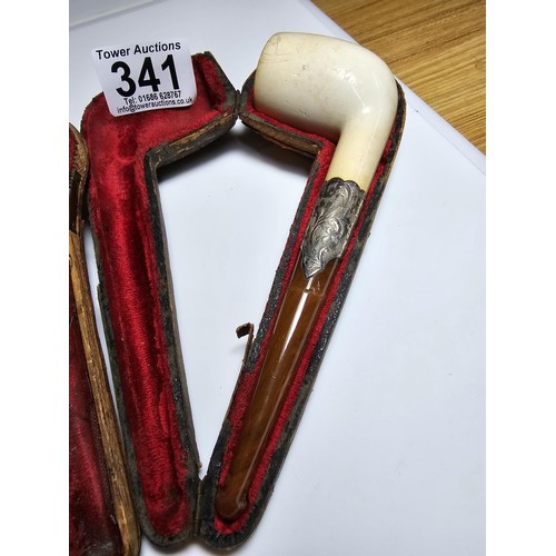 341 - 2x good quality vintage cased smoking pipes both having  hallmarked silver ferrules and solid amber ... 