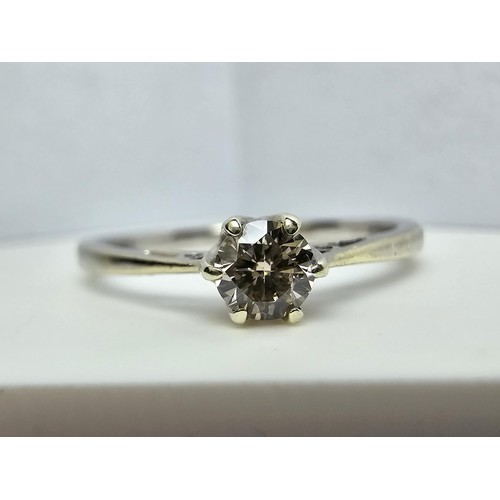 343 - A stunning hallmarked 9ct white gold solitaire diamond ring inset with a very sparkly 0.25 CT diamon... 