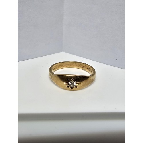 345 - A 9CT yellow gold ring inset with a sparkly single diamond which is .064ct in weight, appears unmark... 