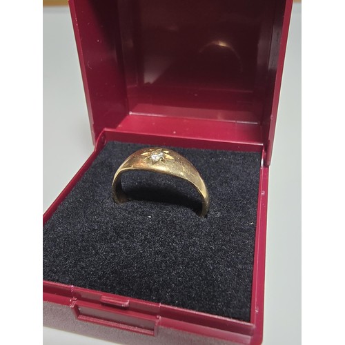 345 - A 9CT yellow gold ring inset with a sparkly single diamond which is .064ct in weight, appears unmark... 