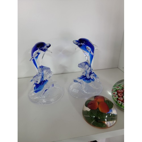 119 - 3x art glass figures which includes 2x clear and blue glass dolphins and clear glass eagle along wit... 