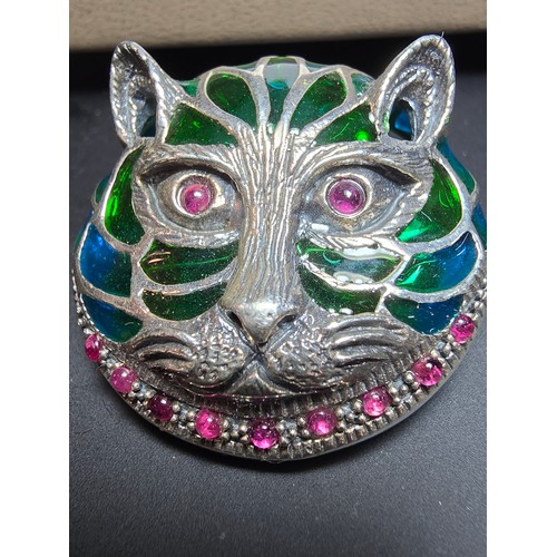 360 - A stunning 925 silver cat faced formed brooch with pretty blue and green stained glass backing, the ... 