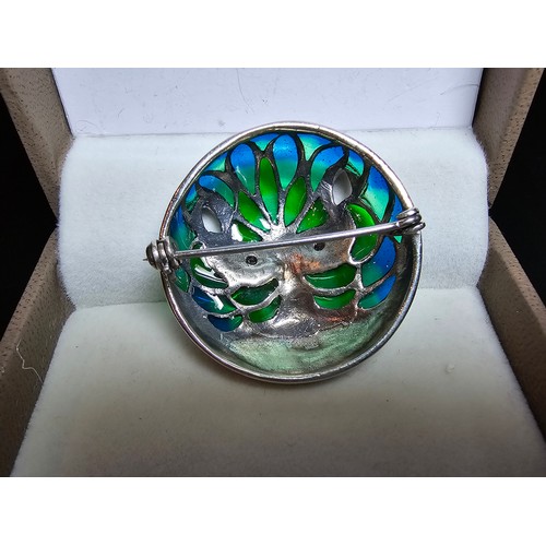 360 - A stunning 925 silver cat faced formed brooch with pretty blue and green stained glass backing, the ... 