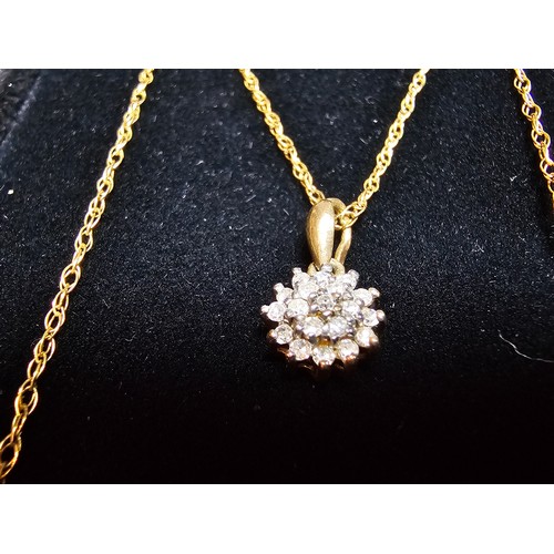 362 - A stunning hallmarked 9ct yellow gold diamond cluster pendant set on an 18