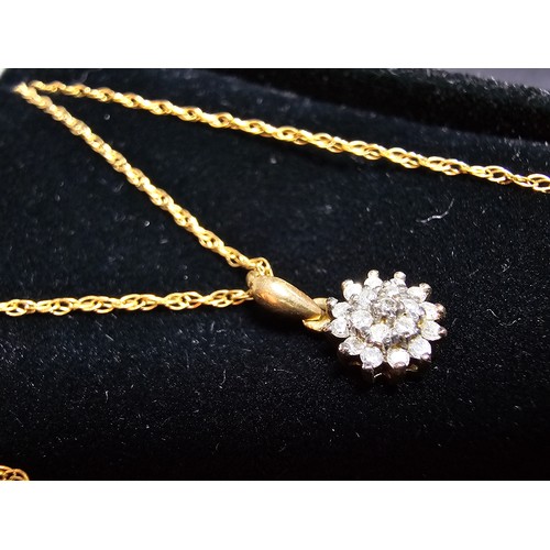 362 - A stunning hallmarked 9ct yellow gold diamond cluster pendant set on an 18