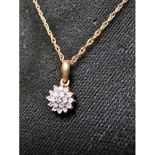 362 - A stunning hallmarked 9ct yellow gold diamond cluster pendant set on an 18