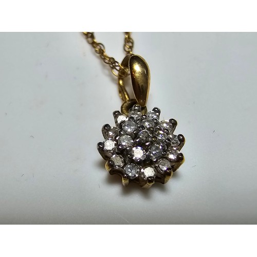 362 - A stunning hallmarked 9ct yellow gold diamond cluster pendant set on an 18