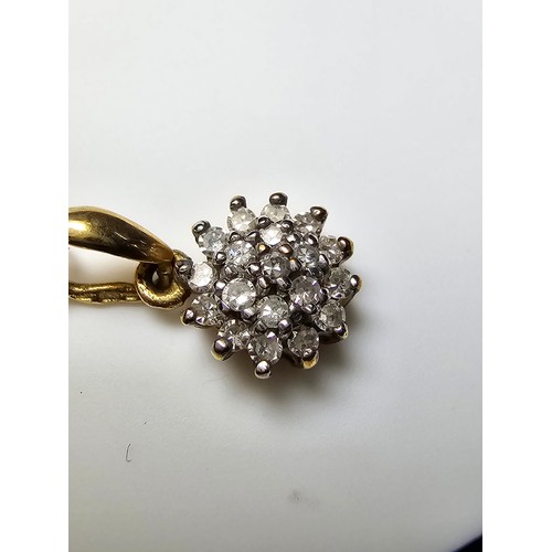 362 - A stunning hallmarked 9ct yellow gold diamond cluster pendant set on an 18