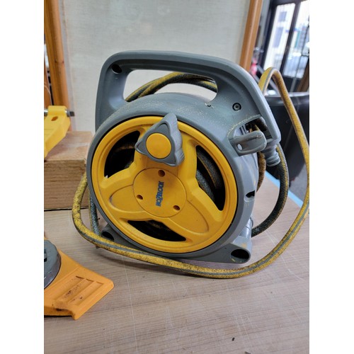 160 - Hozelock reel with hose along with a quantity of hozelock attachments inc a hozelock sprinkler