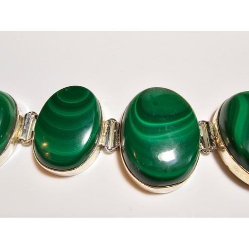 251 - A stunning 925 silver bracelet inset with large oval natural Malachite stones presenting an excellen... 