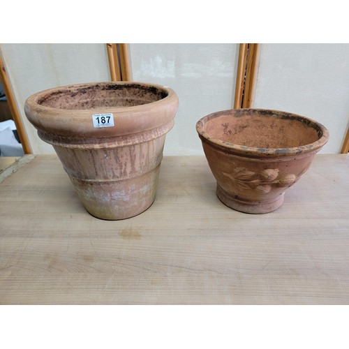 187 - 2x large good quality terracotta planters one with a poeny design to the side both in good order lar... 