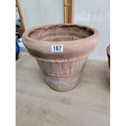 187 - 2x large good quality terracotta planters one with a poeny design to the side both in good order lar... 