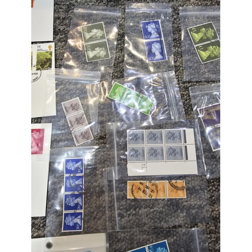 250 - A large collection of organized stamps in individual bags, some are mint stamp blocks covering many ... 