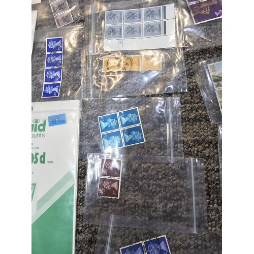 250 - A large collection of organized stamps in individual bags, some are mint stamp blocks covering many ... 