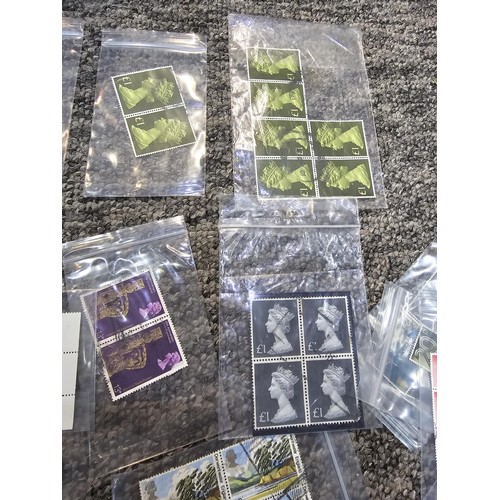 250 - A large collection of organized stamps in individual bags, some are mint stamp blocks covering many ... 