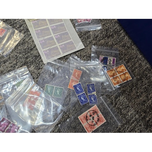 250 - A large collection of organized stamps in individual bags, some are mint stamp blocks covering many ... 