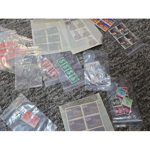 250 - A large collection of organized stamps in individual bags, some are mint stamp blocks covering many ... 