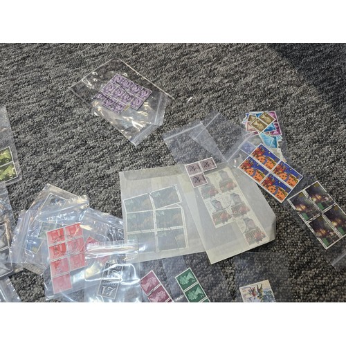 250 - A large collection of organized stamps in individual bags, some are mint stamp blocks covering many ... 