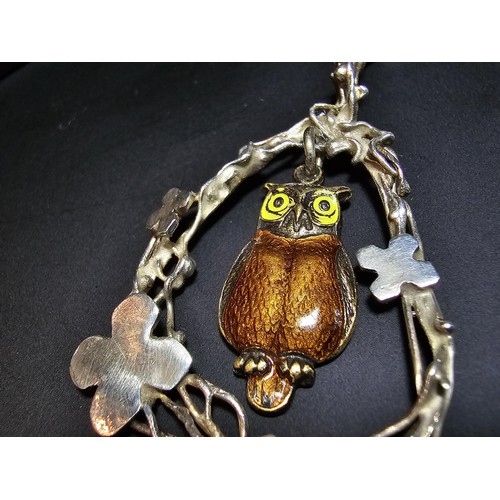 254 - An arts and crafts sterling silver pendant having an enamel gilt owl centre drop, in good clean cond... 