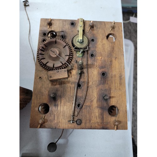 203 - A quantity of clock parts inc an antique 1820's mostly wooden American Elbridge Atkins movement in g... 