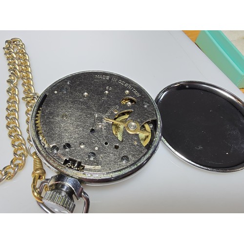 266 - A vintage chrome Ingersoll pocketwatch complete with chain and display box, has been tested for a sh... 