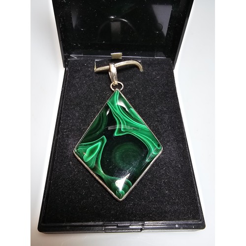 267 - A good quality 925 silver statement pendant inset with a large diamond shaped malachite stone presen... 