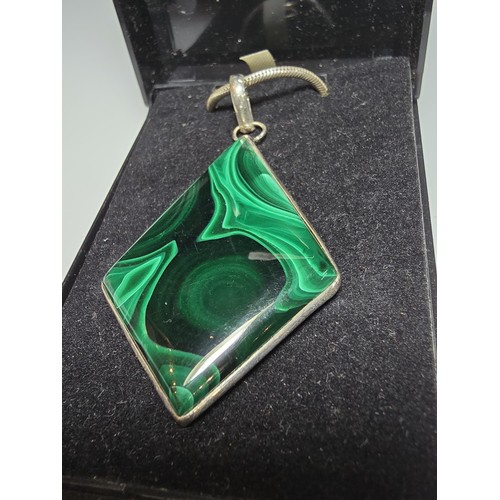 267 - A good quality 925 silver statement pendant inset with a large diamond shaped malachite stone presen... 