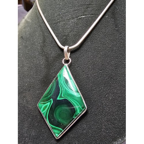 267 - A good quality 925 silver statement pendant inset with a large diamond shaped malachite stone presen... 