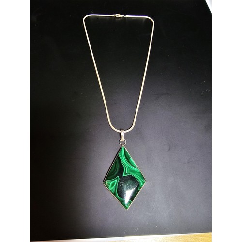 267 - A good quality 925 silver statement pendant inset with a large diamond shaped malachite stone presen... 