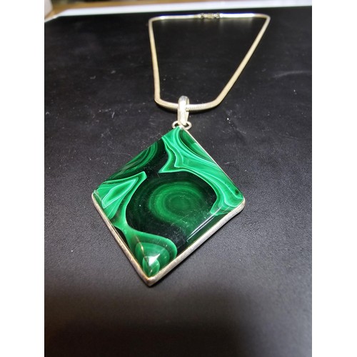 267 - A good quality 925 silver statement pendant inset with a large diamond shaped malachite stone presen... 