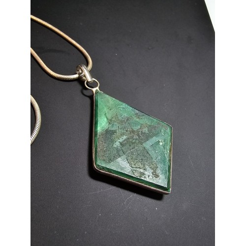 267 - A good quality 925 silver statement pendant inset with a large diamond shaped malachite stone presen... 