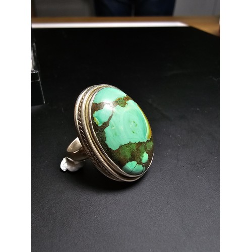 269 - A large 925 silver statement ring inset with a large oval chrysocola stone (a combination of malachi... 