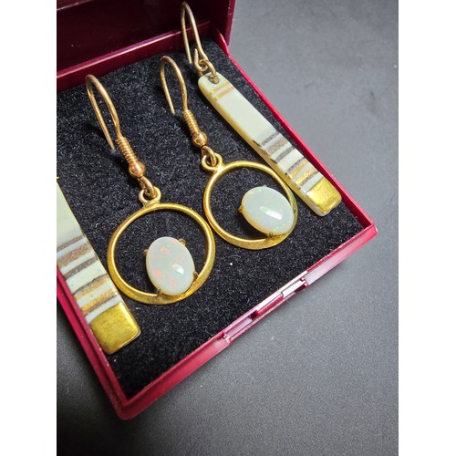 272 - 2x pairs of gold plated earrings, 1 pair is inset with natural white opal stones presenting colourfu... 