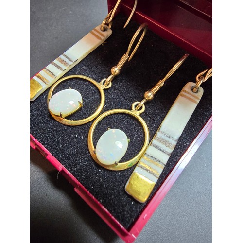 272 - 2x pairs of gold plated earrings, 1 pair is inset with natural white opal stones presenting colourfu... 