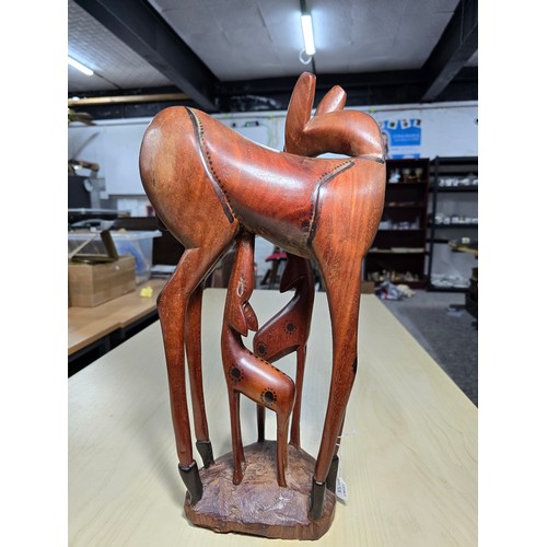 367 - Good quality large and impressive African solid wood carved figure group of a giraffe and its 2 youn... 