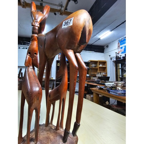 367 - Good quality large and impressive African solid wood carved figure group of a giraffe and its 2 youn... 