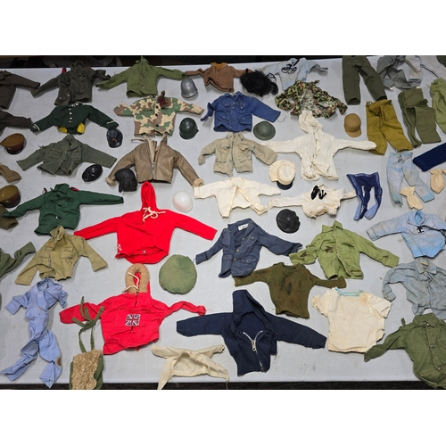 76 - A Large Comprehensive Collection of 1960's / 70's Action Man clothing and uniforms which includes ma... 