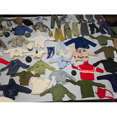 76 - A Large Comprehensive Collection of 1960's / 70's Action Man clothing and uniforms which includes ma... 