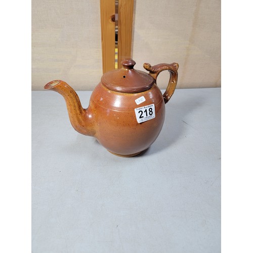 218 - Good quality earthenware hand made teapot with detailed handle, in very good all round condition sta... 