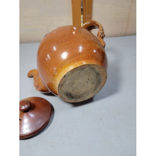 218 - Good quality earthenware hand made teapot with detailed handle, in very good all round condition sta... 