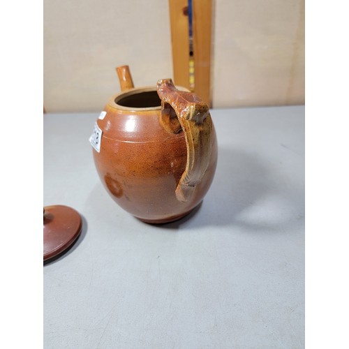 218 - Good quality earthenware hand made teapot with detailed handle, in very good all round condition sta... 