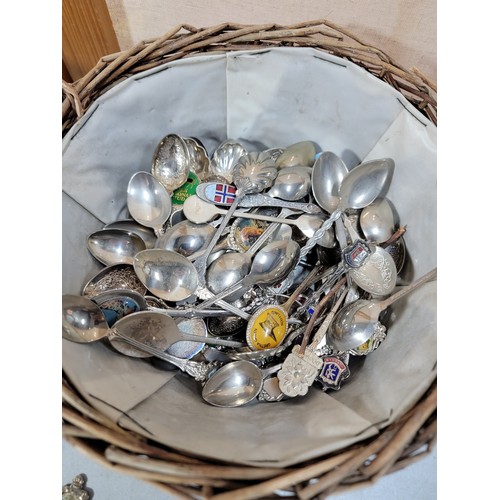 226 - 2x wicker baskets containing a large quantity of collectable teaspoons from around the world, some a... 