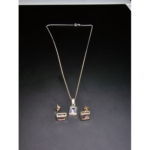 283 - A pretty 925 silver matching jewellery set includes pendant chain and earrings, all inset with spark... 