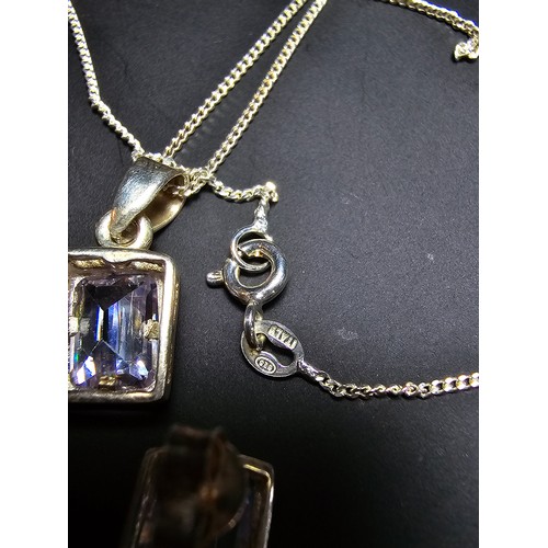 283 - A pretty 925 silver matching jewellery set includes pendant chain and earrings, all inset with spark... 