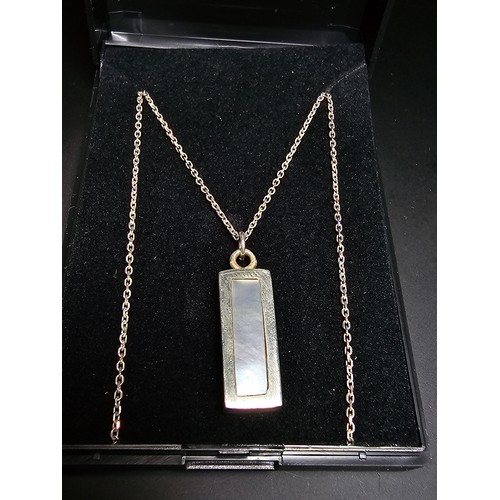 286 - A chunky 925 silver bar pendant inset with mother of pearl and having good flashing colours set on a... 