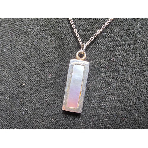 286 - A chunky 925 silver bar pendant inset with mother of pearl and having good flashing colours set on a... 