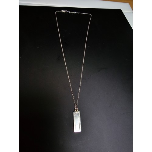 286 - A chunky 925 silver bar pendant inset with mother of pearl and having good flashing colours set on a... 